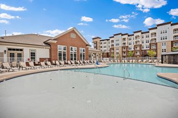 A pool with apartment buildings